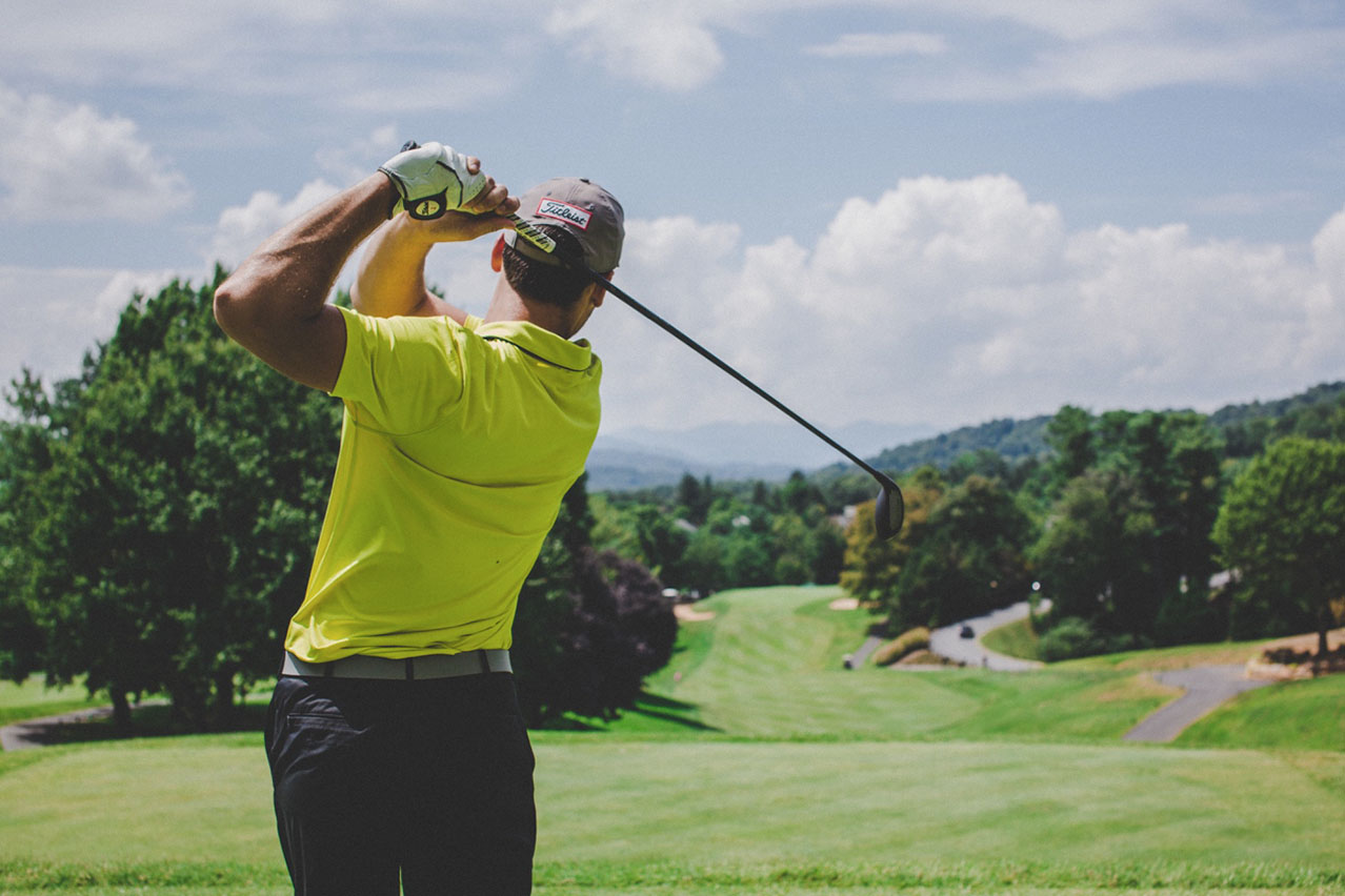 man golfing