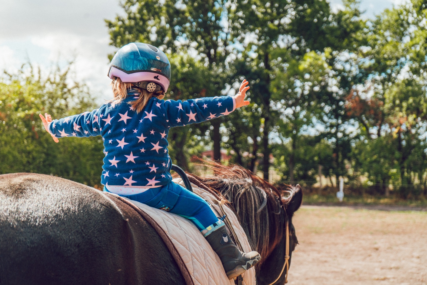 little girl on horseback