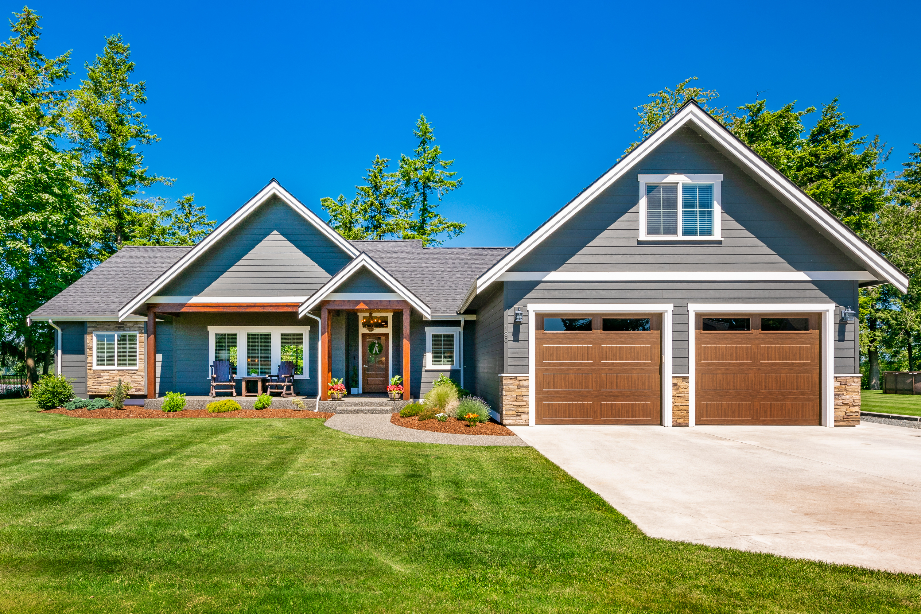 Craftsman Home with Double Garage Lush Green Lawn And Blue sky