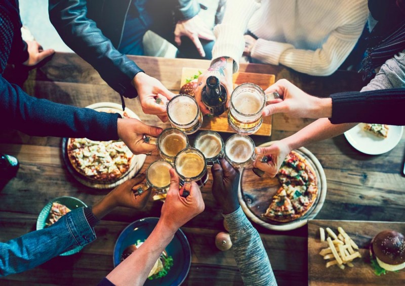 Group of people with beer glasses together